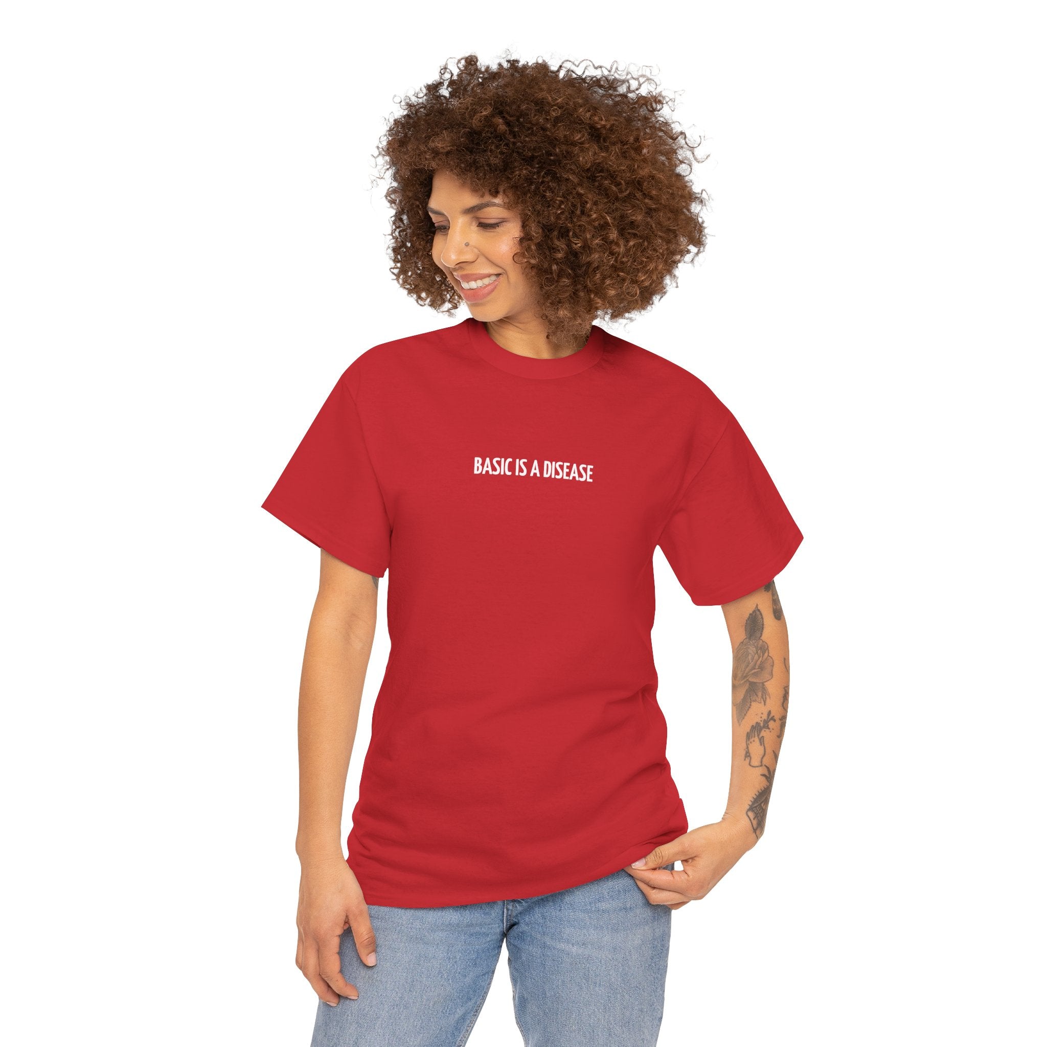 Person wearing a red t-shirt with 'BASIC IS A DISEASE' text on a white background