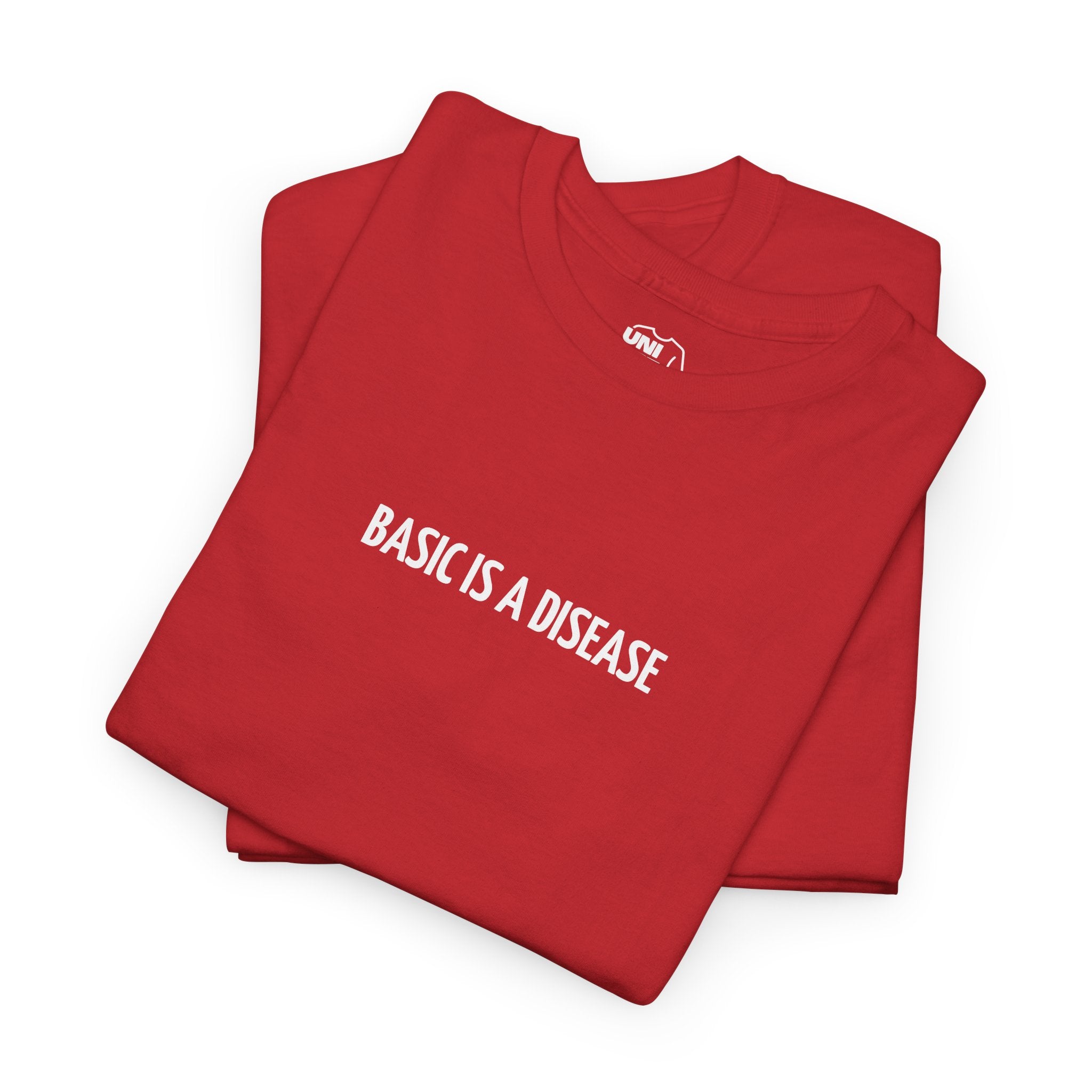 Folded red sweatshirt with 'BASIC IS A DISEASE' text on a white background